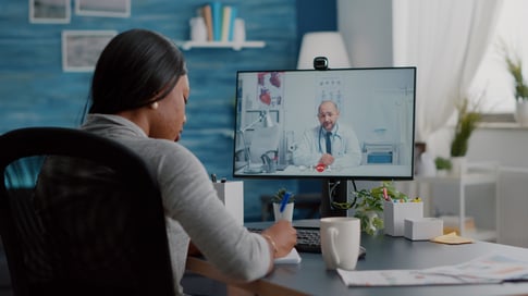 young-woman-writing-respiratory-sickness-treatment-notebook-discussing-pills-treatment-online-healthcare-videocall